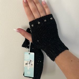 Black mitts with tags